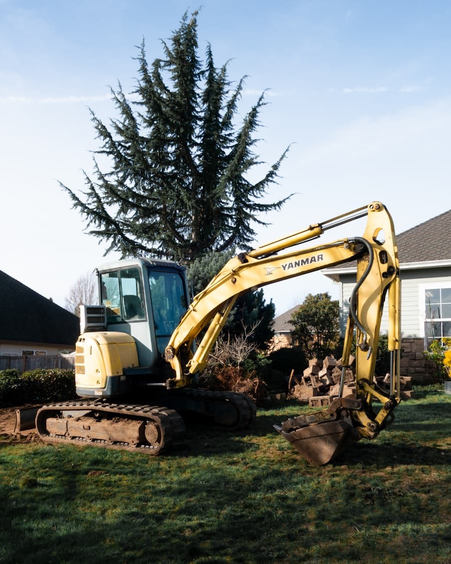 Excavator staged at a residential site before construction