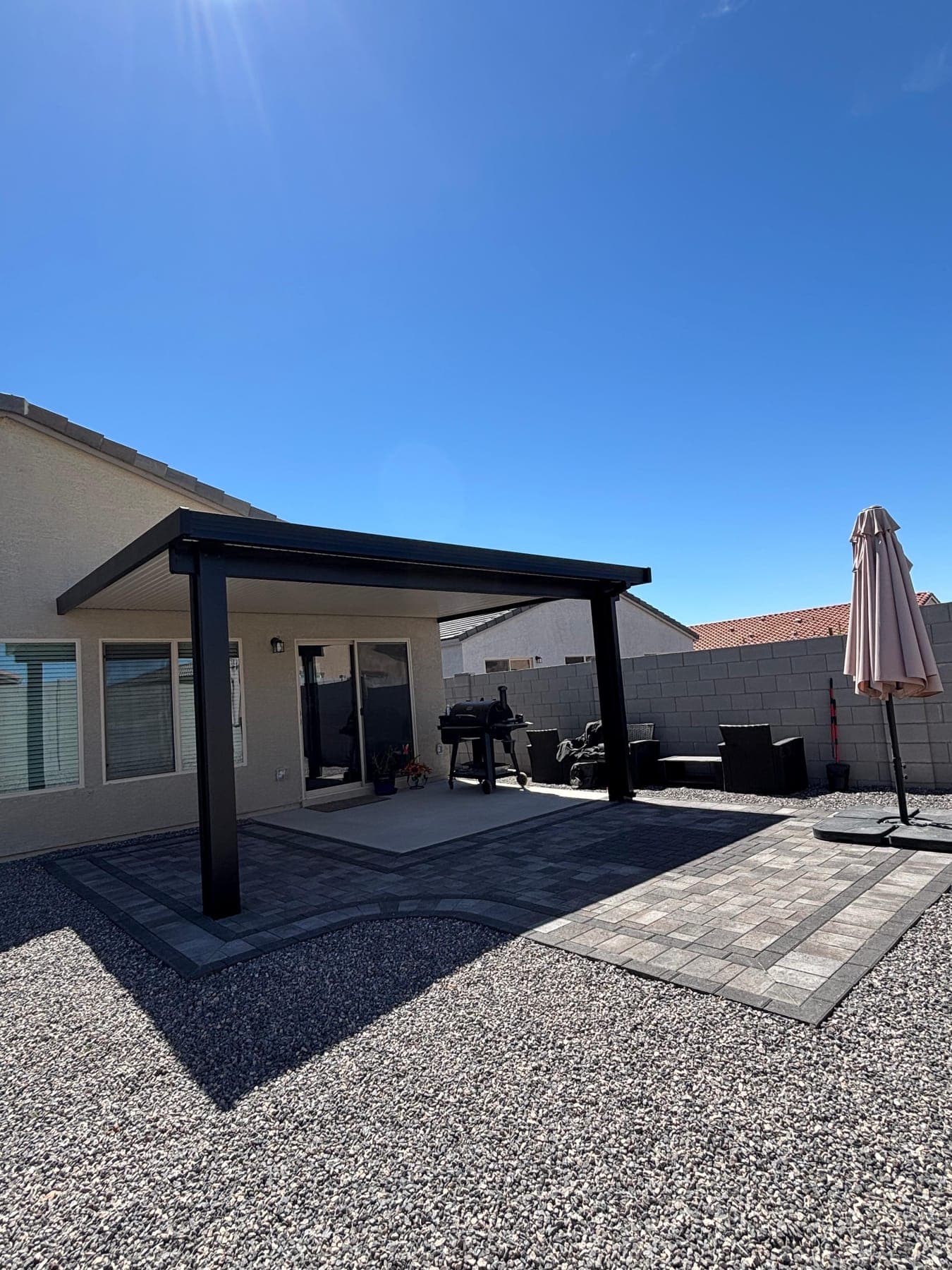 Attached aluminum patio cover in Arizona backyard