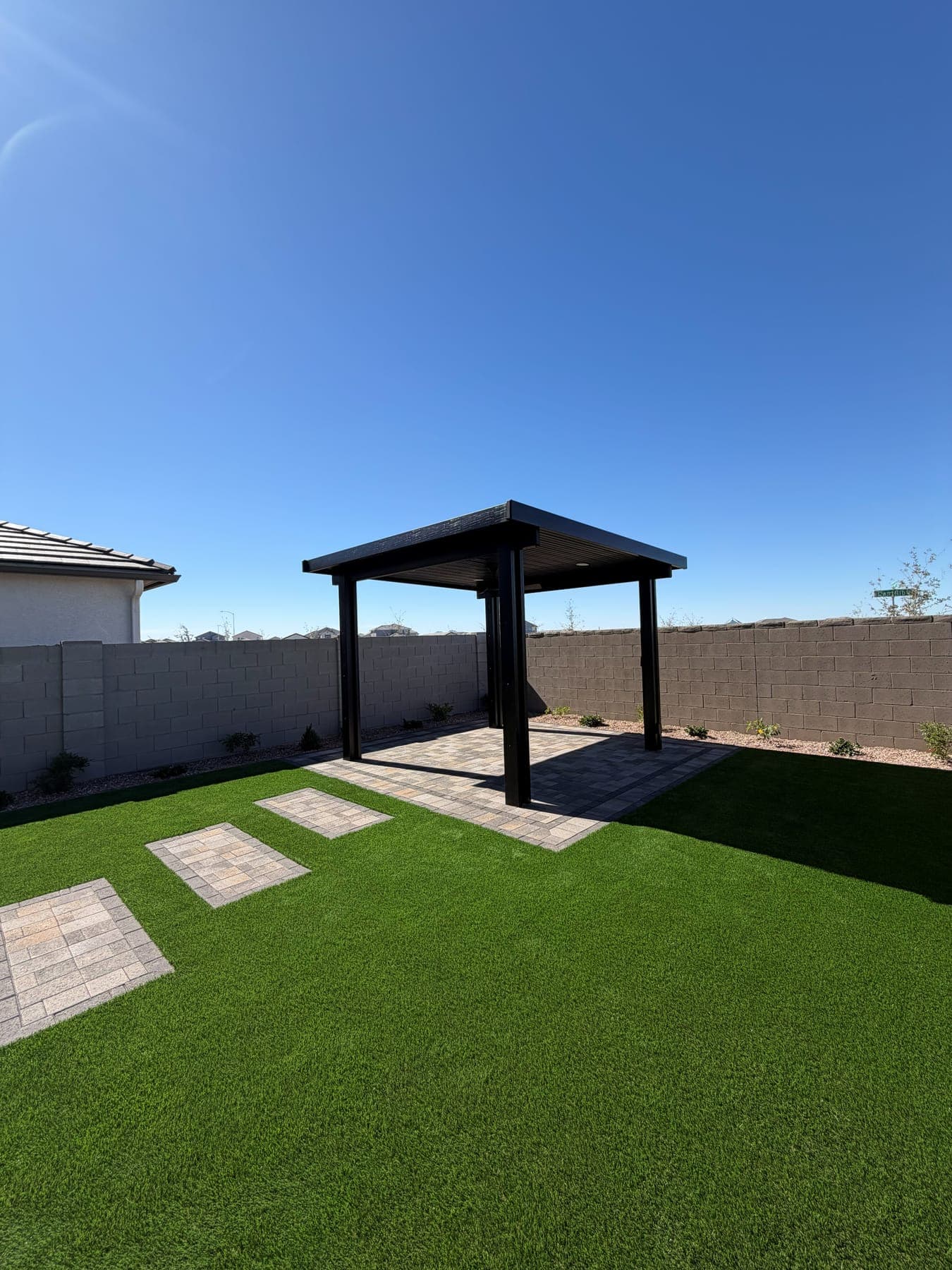 Freestanding ramada shade structure on turf