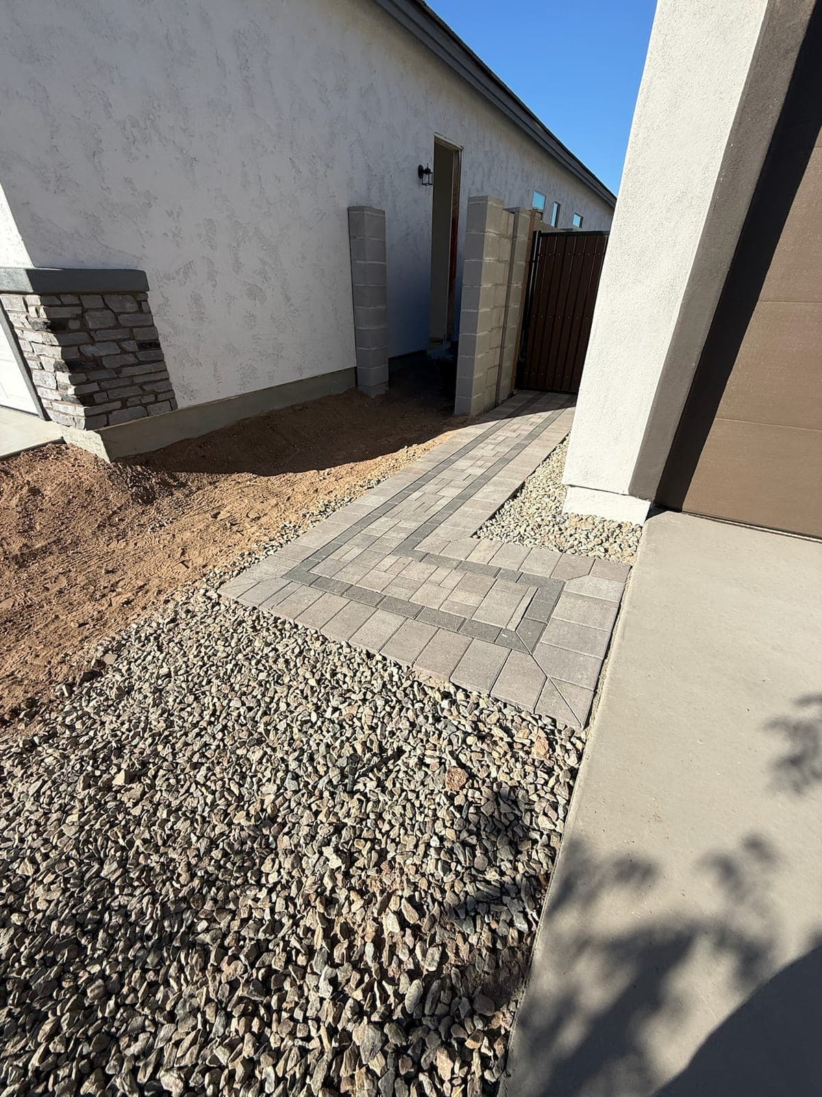Paver walkway and entry sequence with gravel groundcover
