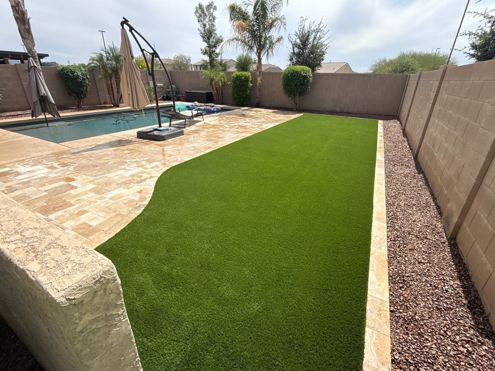 Backyard Oasis — Artificial Turf, Concrete Block Wall, Travertine Pavers in the Phoenix Valley, Arizona